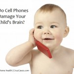 Cute child talking to a cell phone, isolated over white